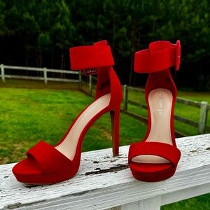 Red suede stilettos.